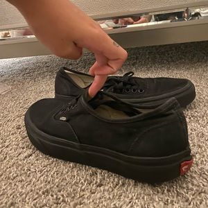 All black low top vans